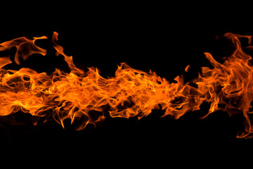 Bright orange red Fire flame against black background with copyspace, abstract texture