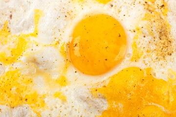 scrambled eggs, broken and whole yolk