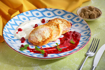 Cheesecakes with berriesand sour cream. Yummy dessert
