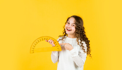 Excited about knowledge. mathematics and people concept. geometric shapes. modern education concept. girl with protractor and triangle ruler. back to school. STEM school disciplines. copy space