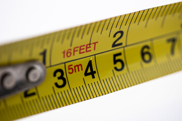 Close up of yellow tape measurer