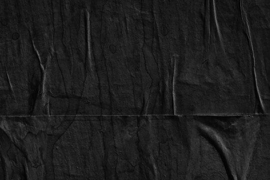 Black grey paper background creased crumpled surface / Old torn ripped posters scary grunge textures © Nikola