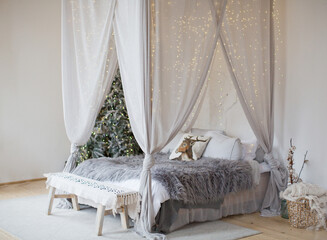 Christmas bedroom canopy with lights © aprilante