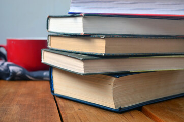 A stack of old books with yellowed pages, textbook, training, encyclopedia. Reading, knowledge. Library.