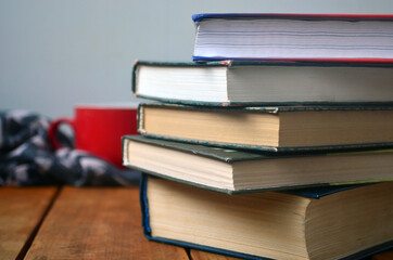 A stack of old books with yellowed pages, textbook, training, encyclopedia. Reading, knowledge. Library.