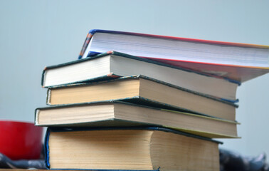 A stack of old books with yellowed pages, textbook, training, encyclopedia. Reading, knowledge. Library.
