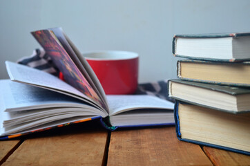 A stack of old books with yellowed pages, textbook, training, encyclopedia. Reading, knowledge. Library.