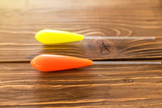 Bombarda float for fishing on wood background.