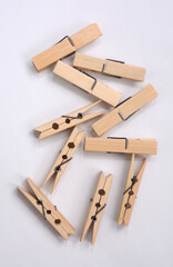 Wooden clothes pin. Closeup pin set on white background