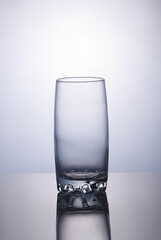 Empty glass over white background