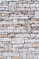 wall texture made of cut stone. stone wall background.