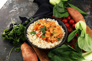 Chicken tikka masala spicy curry meat food in pot with rice and naan bread. indian food