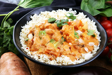 Chicken tikka masala spicy curry meat food in pot with rice and naan bread. indian food