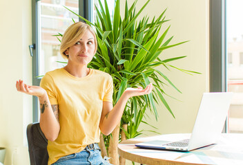 pretty blonde woman with a laptop