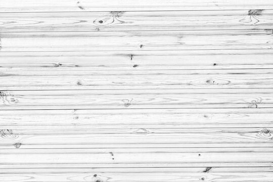 Vertical wooden wall from horizontal planks. Black and white wooden background.