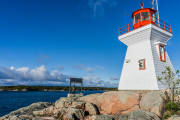 Fototapeta na wymiar Killarney East Lighthouse on a sunny morning. This lighthouse sit on the rugged Georgian Bay, on the Lake Huron, in Ontario