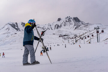 Fototapeta na wymiar People skiing in Erciyes ski resort. Snowy Mount Erciyes