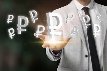 Money exchange concept. Businessman with Russian ruble currency symbols on blurred background, closeup