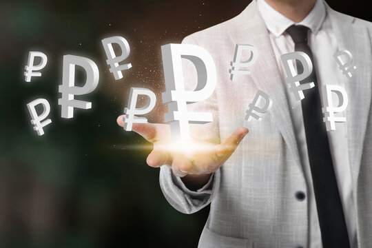 Money exchange concept. Businessman with Russian ruble currency symbols on blurred background, closeup