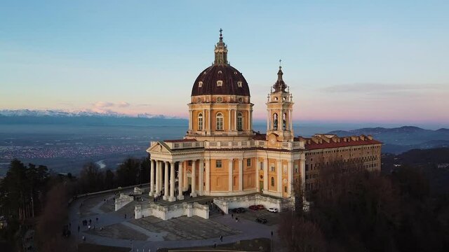 Sunset over Basilica of Superga in Italy, wide aerial