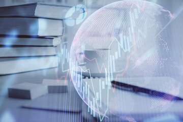 Double exposure of financial chart drawing and desktop with coffee and items on table background. Concept of forex market trading