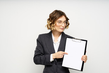 Woman in business suit finances work documents glasses hairstyle