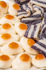 multicolored chewing marmalade. Texture of dessert marmalade with a sweet-sour taste. Jelly candies in yellow, white and orange colors.