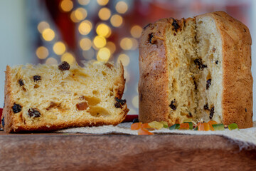 Panettone, slice of Italian Christmas cake on the table.