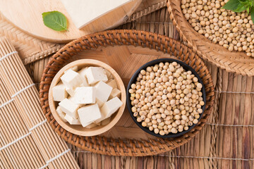 Fresh cube tofu and soybean seeds in a bowl prepare for cooking, Asian vegan food, Top view