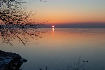 sunrise on the lake in winter
