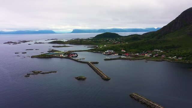 Aerial view towards the Sto village at the end of the Vesteralen islands, overcast day, in North Norway - dolly, drone shot