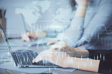 Multi exposure of woman hands typing on computer and financial chart hologram drawing. Stock market analysis concept.