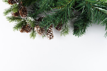 Christmas new year composition on white background. Fir branches, christmas decoration. Flat lay, top view, copy space