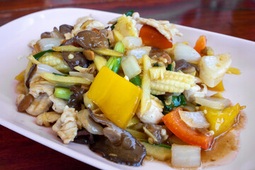 Thai food, stir fried chicken with ginger, mushrooms and peppers