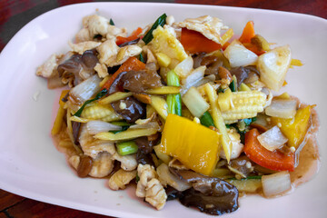 Thai food, stir fried chicken with ginger, mushrooms and peppers
