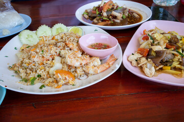 Thai shrimp fried rice with sauce and cucumber slices