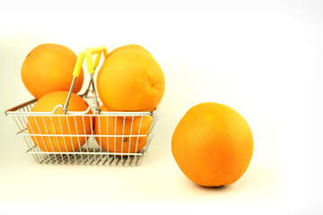 Fresh oranges in a basket on a white background