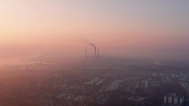 Orange foggy sunrise over Warsaw, Poland. Smog reduces visibility