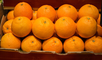 fresh orange in paper crate at super market for background.