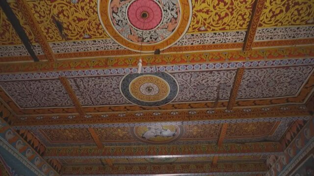 Ornate buddhist hand painted ceiling