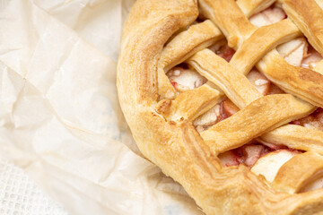 dessert baking concept. apple pie above view on a paper background. studio shot. homemade cooking concept