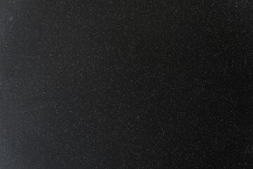 Old black and white spotted texture background made of stone. Concept of food and product photography.