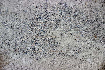 texture of old concrete with gravel and rusty rebar
