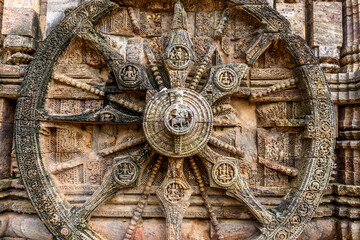 Ancient sandstone carvings on the walls of the ancient sun temple at Konark, India.
