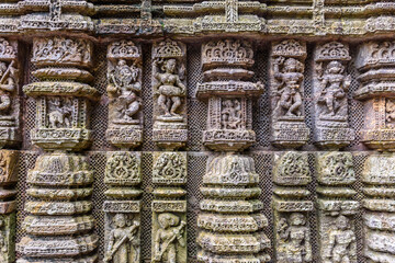 Ancient sandstone carvings on the walls of the ancient sun temple at Konark, India.

