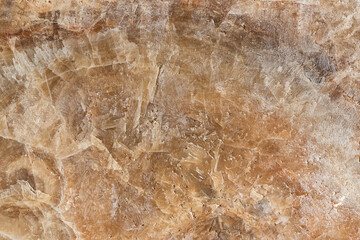 seamless background texture of natural raw stone brown granite
