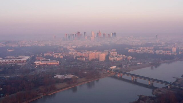 Calm pastel aerial scene of sunrise over Warsaw.