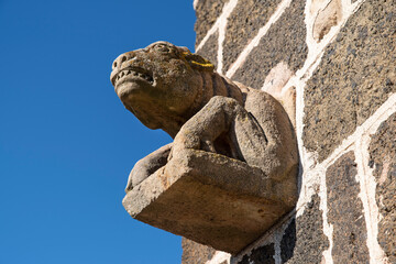 Gargoyle on a church in the town of Le Puy en Velay in France
