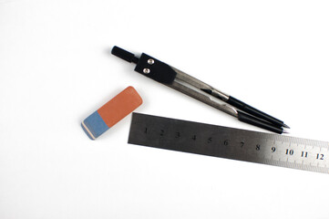 Geometry set with compass andruler on white paper background