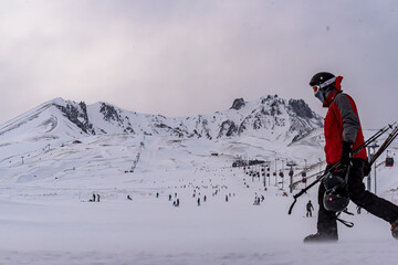 Fototapeta na wymiar People skiing in Erciyes ski resort. Snowy Mount Erciyes